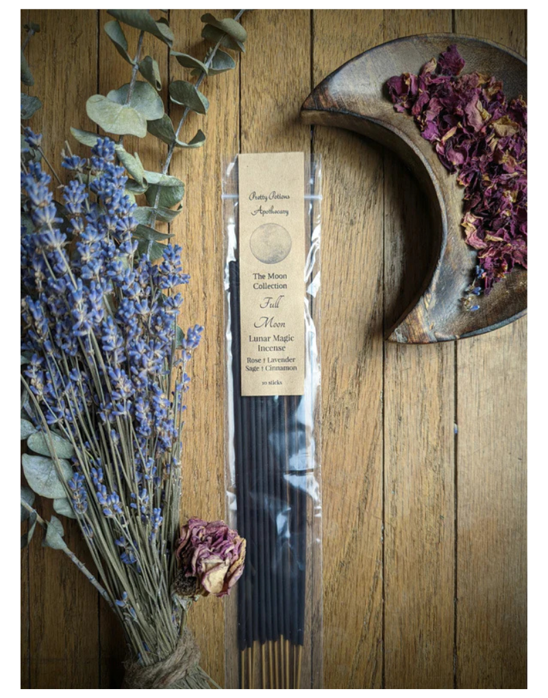 A pack of incense sticks displayed alongside rose petals and lavender, suggestive of the ingredients or thematic styling of the product.